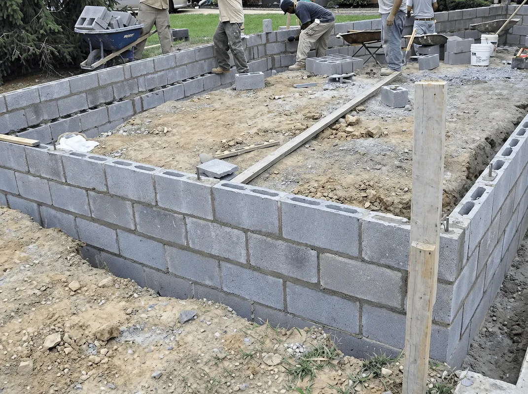 Professionals building a foundation with blocks in Riverside, CA
