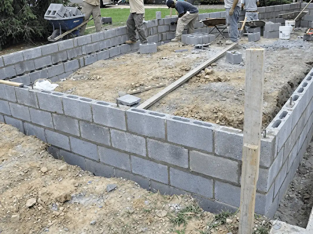 Professionals building a foundation with blocks in Riverside, CA